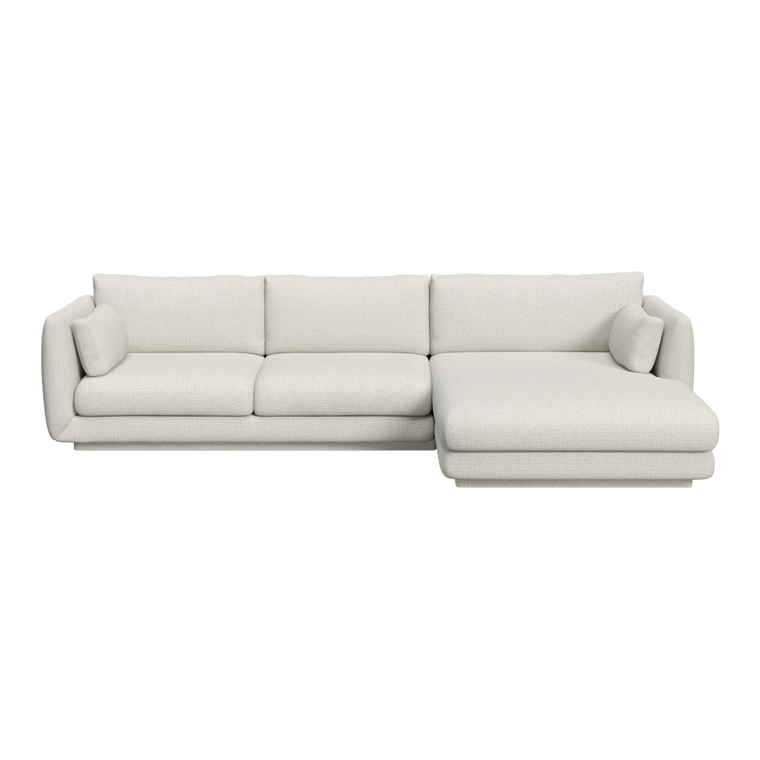 Light beige sectional sofa with a modern minimalist design and smooth, textured upholstery. Perfect for any living space.