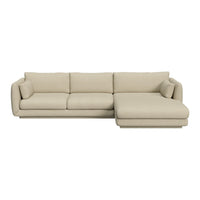 Beige sectional sofa with a smooth, textured fabric and plush cushions, featuring a minimalist and modern design.