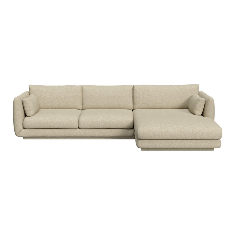 Beige sectional sofa with a smooth, textured fabric and plush cushions, featuring a minimalist and modern design.