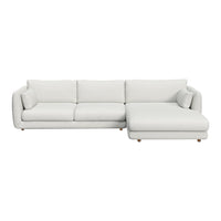 Light gray sectional sofa with smooth fabric and subtle, modern lines. Perfect for stylish living spaces.