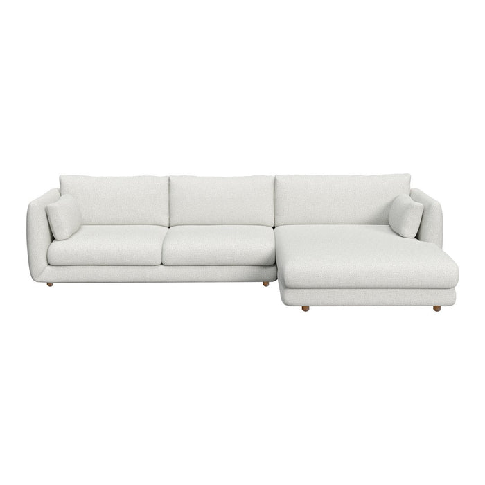 Light gray sectional sofa with smooth fabric and subtle, modern lines. Perfect for stylish living spaces.