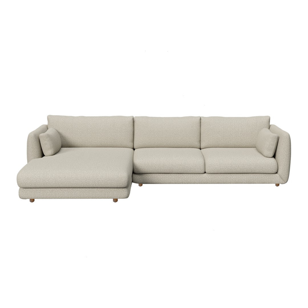 Light beige sectional sofa with a minimalist design and soft, textured fabric. Perfect for modern living spaces.