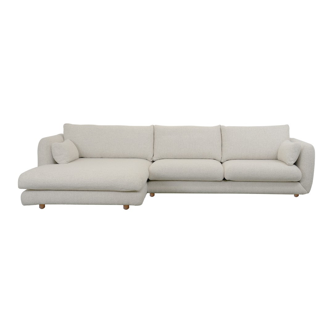 Light beige sectional sofa with smooth fabric and minimalist design, featuring a cozy chaise lounge for added comfort.