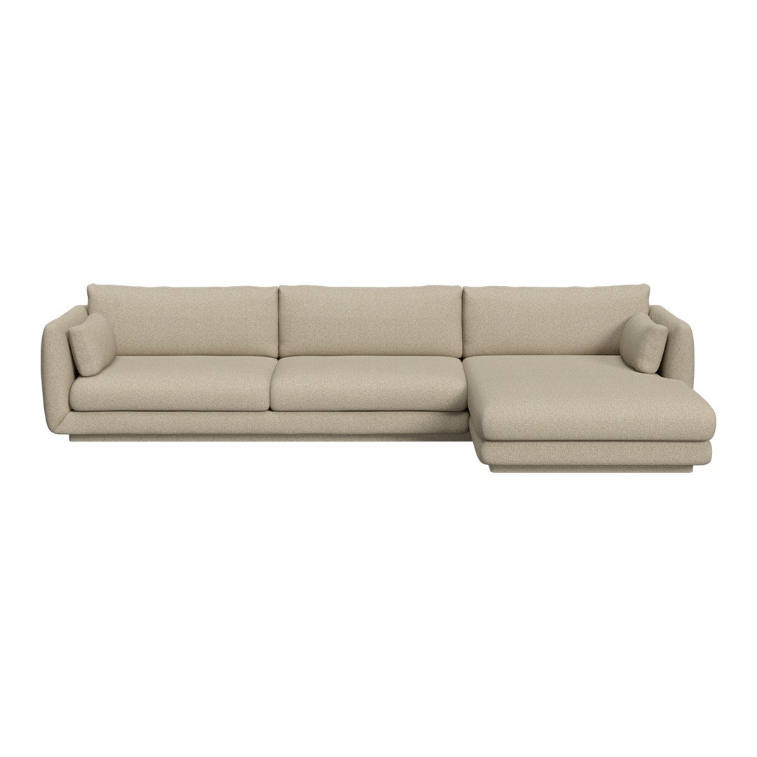 Beige sectional sofa with a sleek, minimalist design and plush fabric. Perfect for modern living spaces.