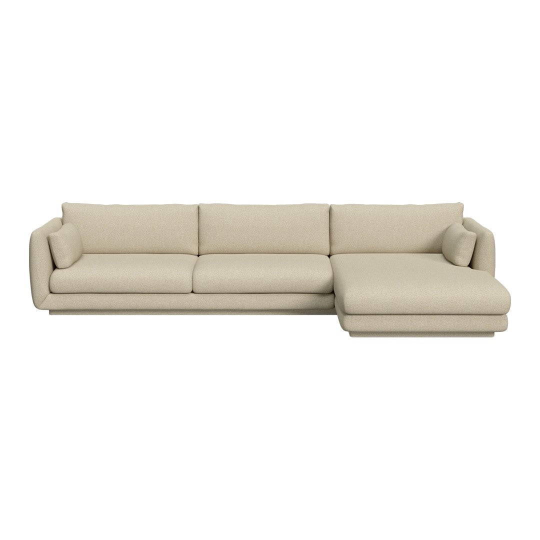 Beige sectional sofa with a smooth, neutral fabric and minimalist design, perfect for modern living spaces.