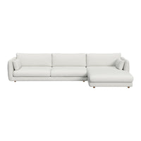 Modern white sectional sofa with sleek lines and plush cushions, featuring solid pale tones and smooth textures.