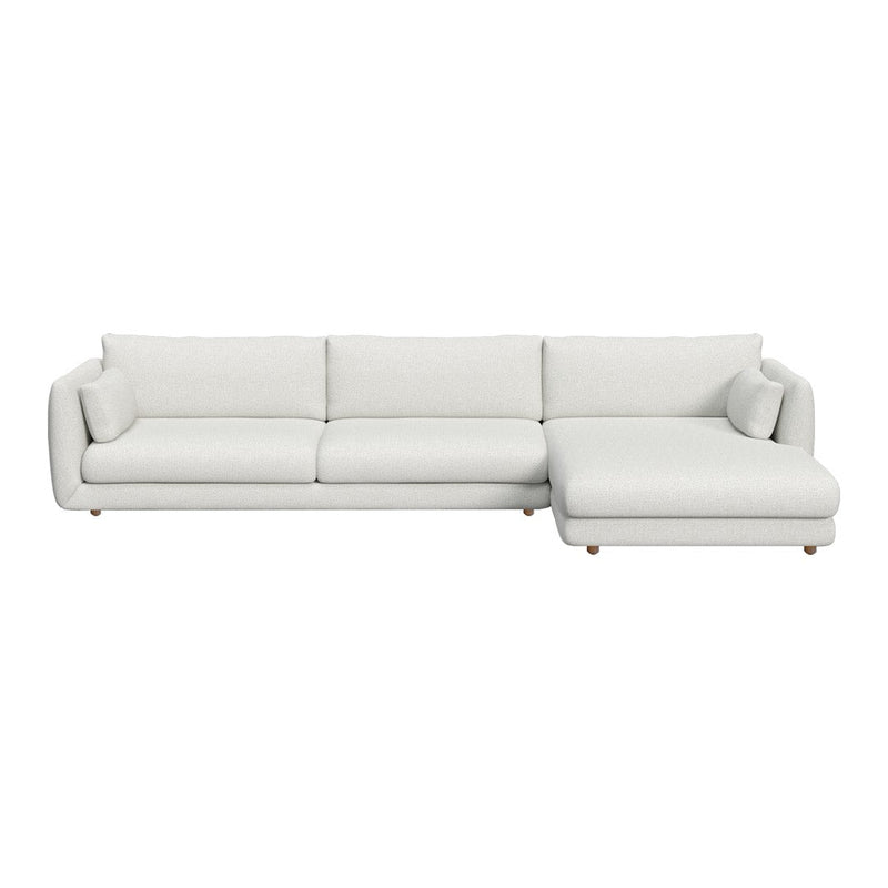 Modern white sectional sofa with sleek lines and plush cushions, featuring solid pale tones and smooth textures.