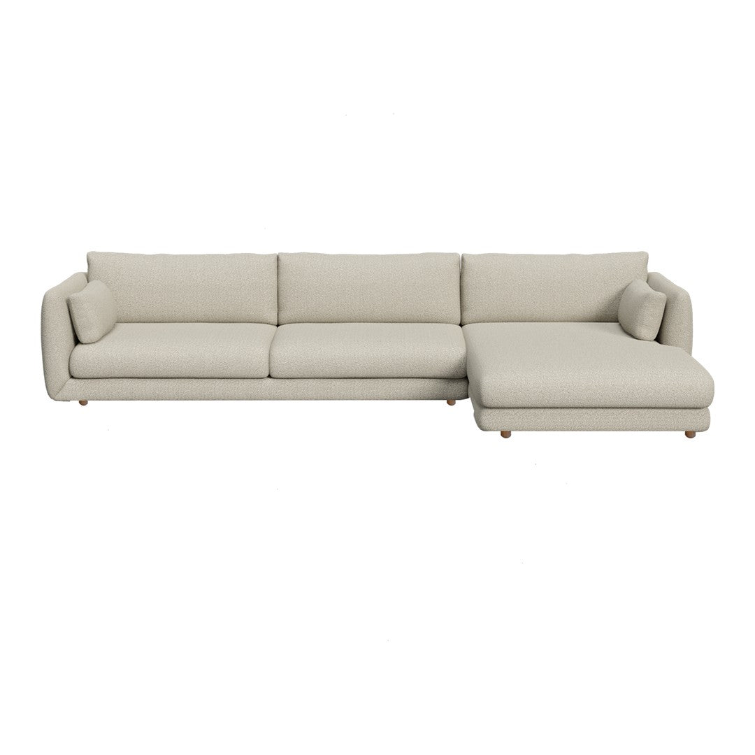 Light beige sectional sofa with a smooth fabric texture and subtle, minimalistic design, perfect for modern interiors.