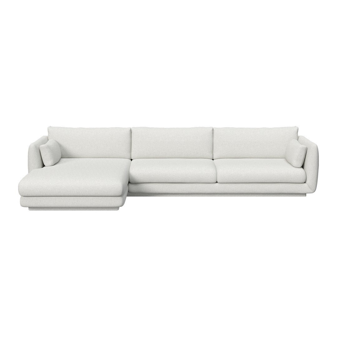 Modern white sectional sofa with smooth upholstery, featuring a minimalist design and clean lines.