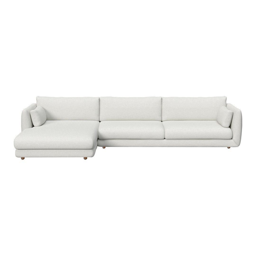 Modern white sectional sofa with plush cushions and minimalist design, perfect for contemporary living spaces.