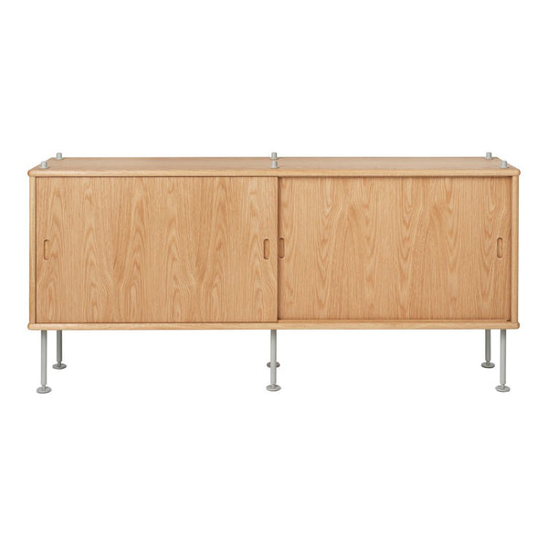 Light wood cabinet with a natural grain pattern, featuring smooth lines and metallic legs for a modern look.