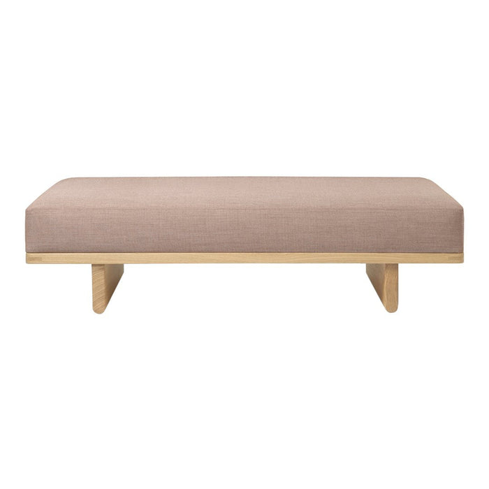 Beige upholstered bench with a smooth, minimalist design and natural wood legs. Ideal for modern decor.