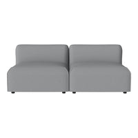 Modern gray modular sofa with a sleek, minimalist design and smooth fabric texture. Perfect for contemporary spaces.