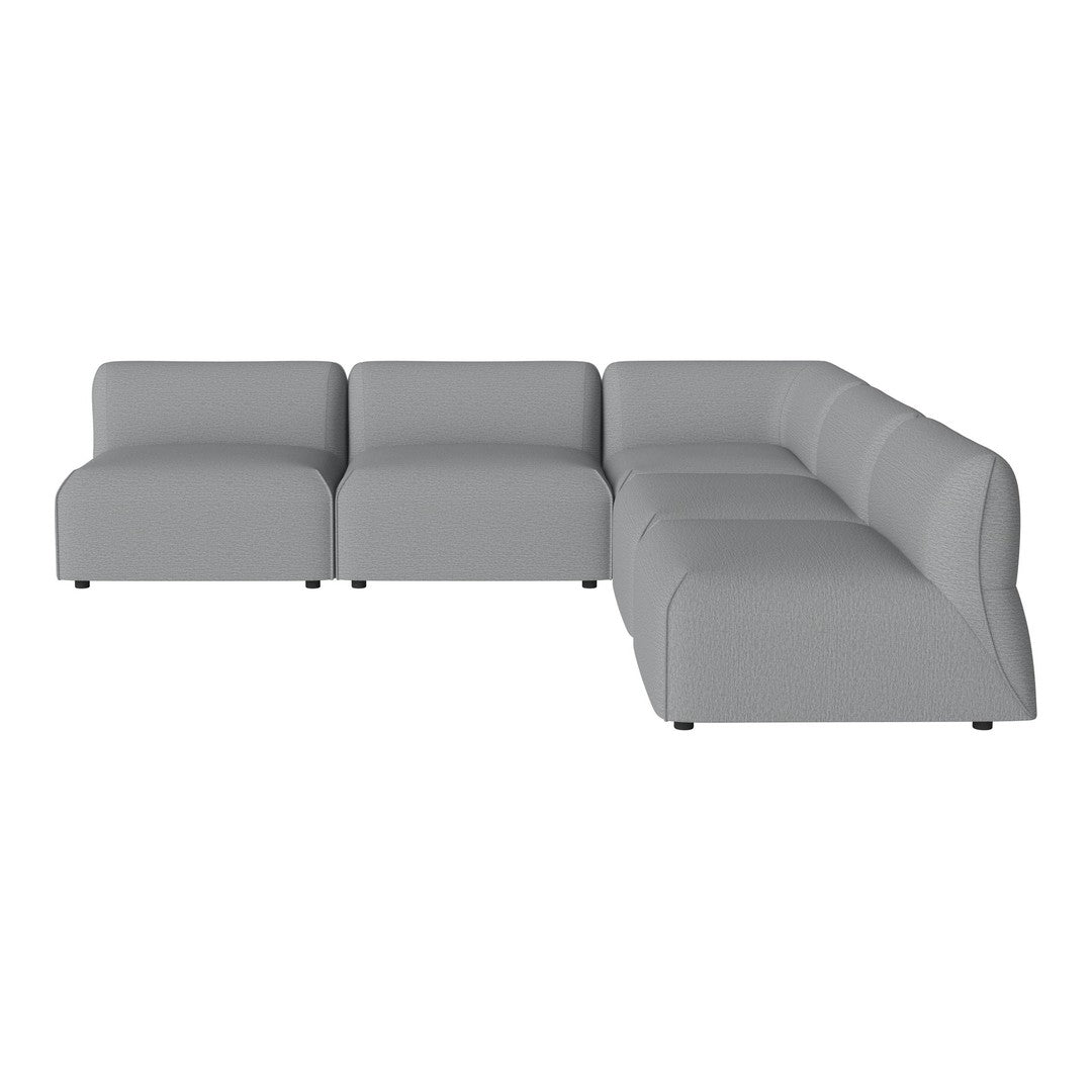 Grey sectional sofa with sleek, minimalist design and smooth fabric for a modern living space.