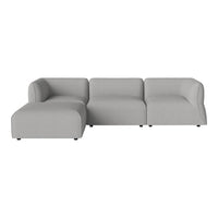 Modern gray sectional sofa with smooth, minimalist design and soft fabric finish, perfect for contemporary interiors.
