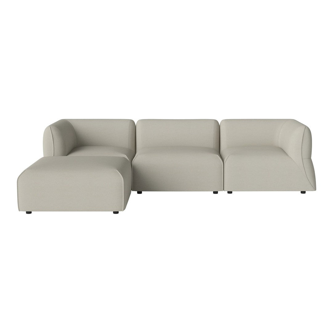 Light beige sectional sofa with a smooth, modern design and clean lines, perfect for contemporary living spaces.