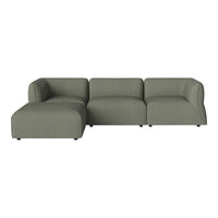 Modern sectional sofa in muted green fabric with smooth, minimalist design and subtle texture. Perfect for contemporary decor.