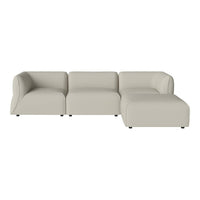 Beige modular sofa with smooth, contemporary design and rounded edges, perfect for modern living spaces.