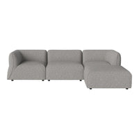 Gray sectional sofa with a smooth texture and contemporary design. Ideal for modern living spaces.