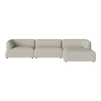 Beige sectional sofa with smooth upholstery and a minimalist design. Ideal for modern and neutral decor styles.