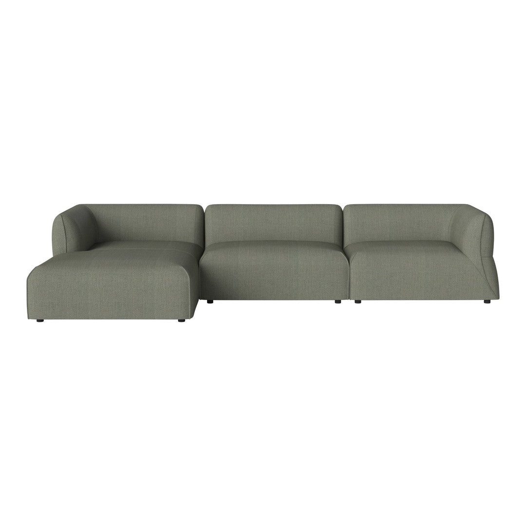Modern sectional sofa in soft sage green fabric with a clean, minimalistic design and subtle texture.