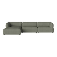 Modern sectional sofa in soft sage green fabric with a clean, minimalistic design and subtle texture.