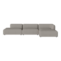 Gray sectional sofa with a smooth, minimalist design and soft fabric for modern interiors.