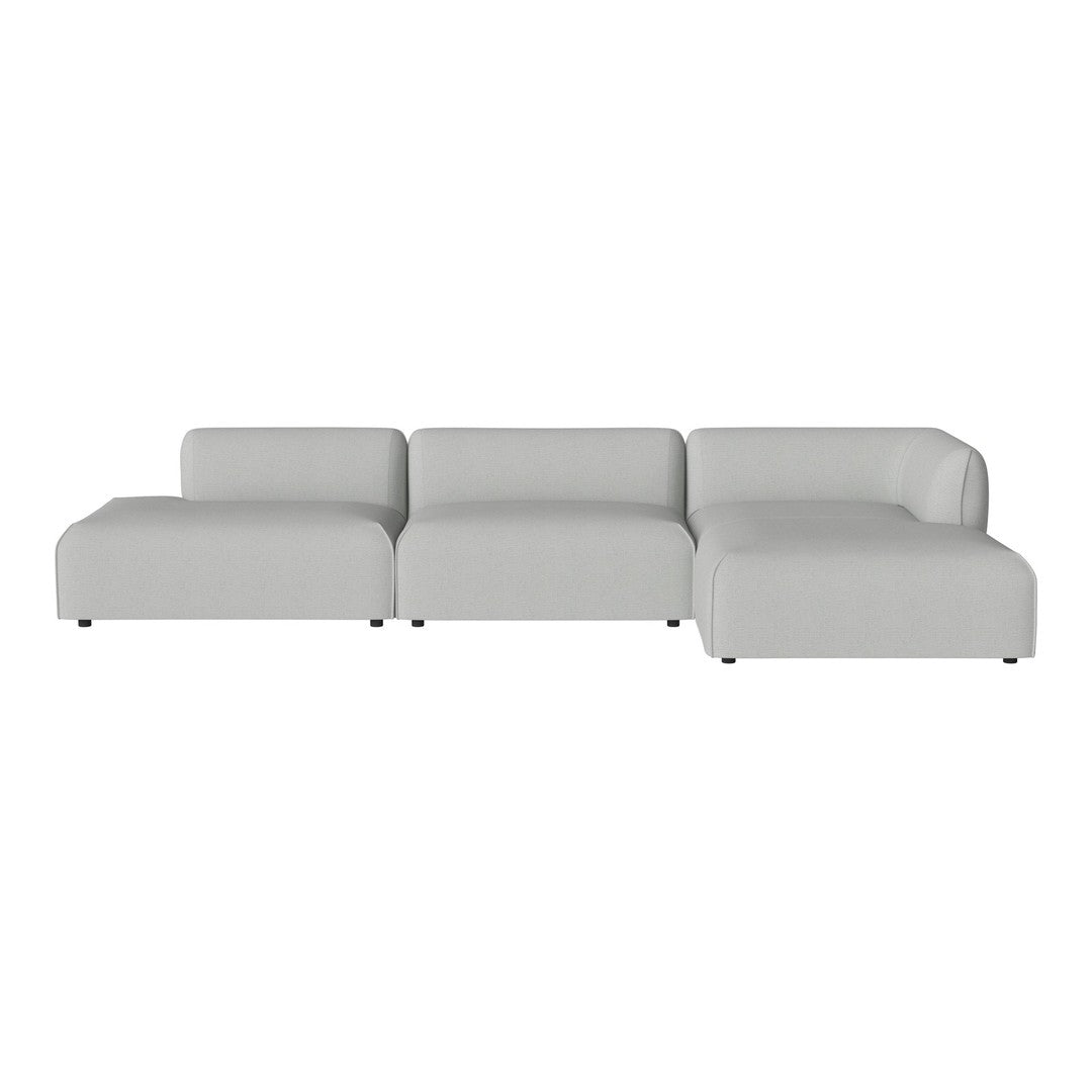 Light gray modular sofa with a smooth, minimalist design, featuring clean lines and no visible patterns.