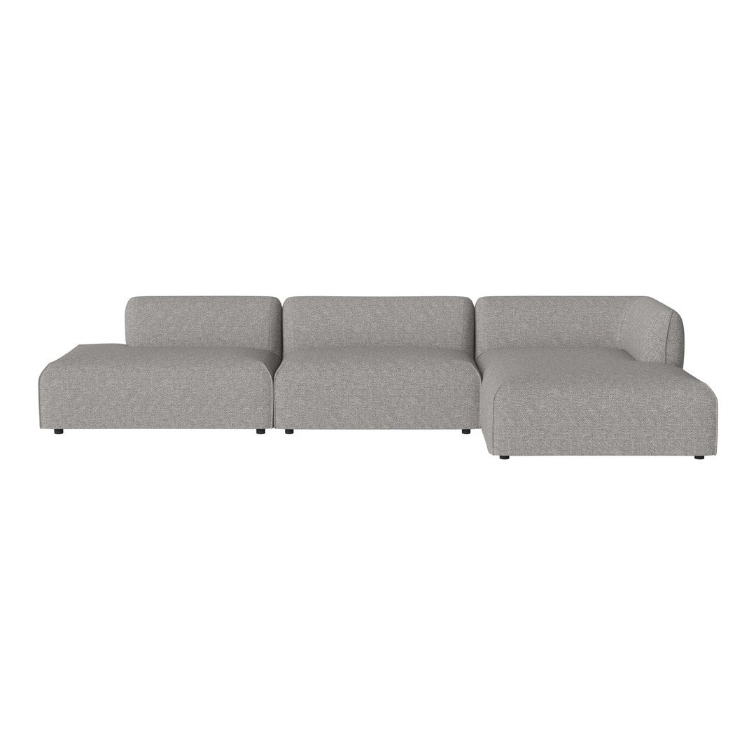 Gray sectional sofa with a smooth, textured pattern. Modern and minimalist design for contemporary living spaces.