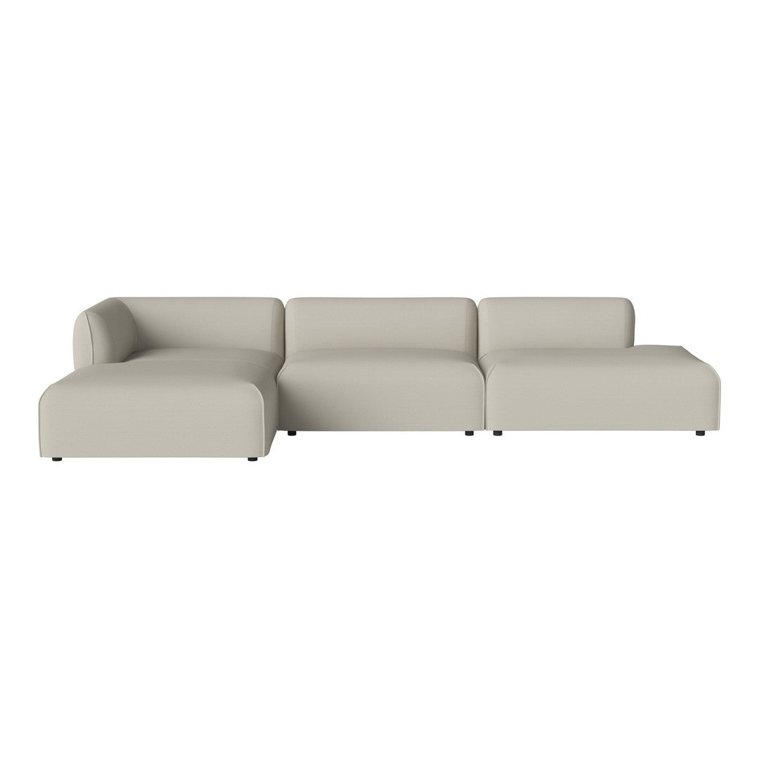 Light beige modular sofa with smooth, minimalist design and soft curves, perfect for modern living spaces.