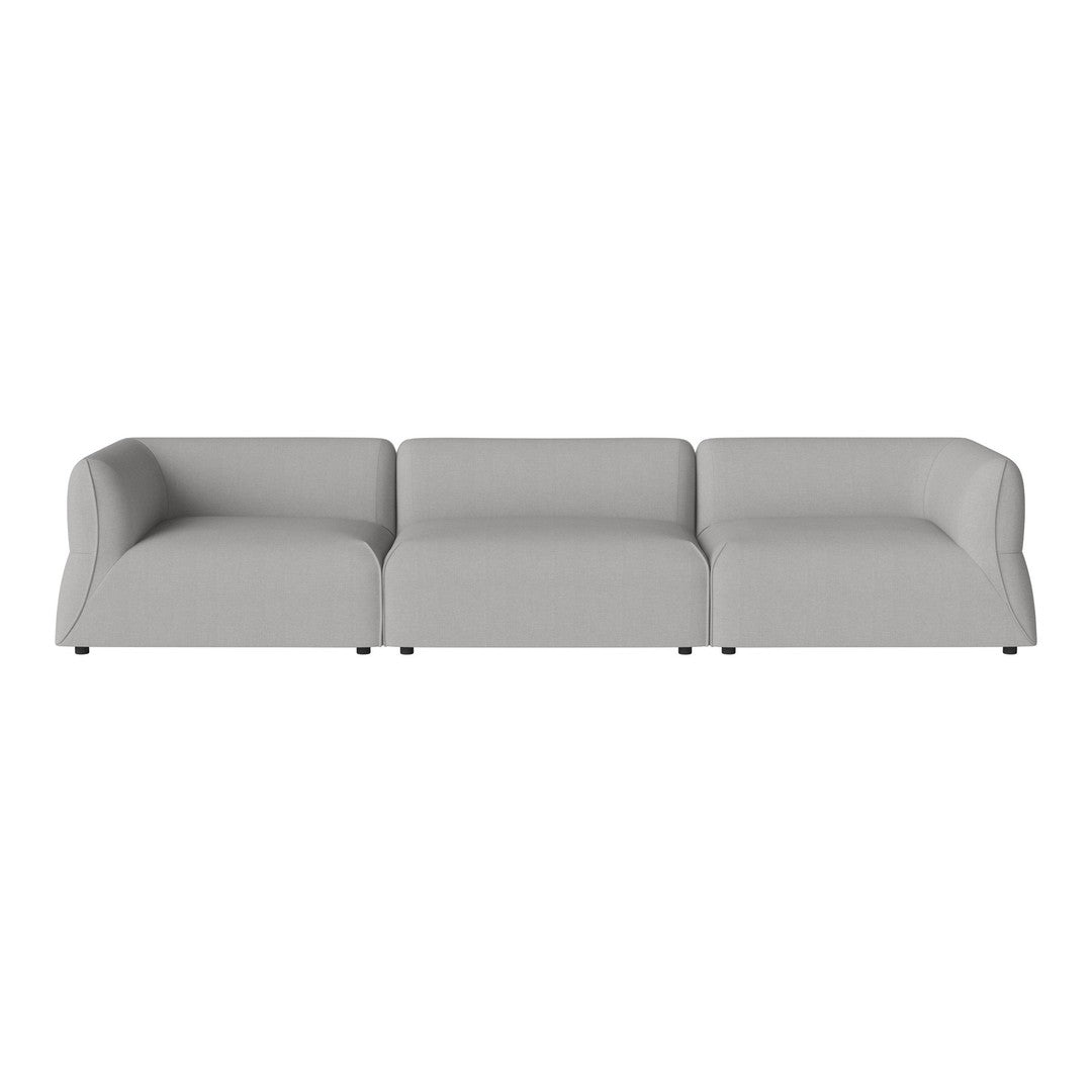 Modern gray sectional sofa with a sleek, minimalist design and soft, smooth fabric. Ideal for contemporary decor.