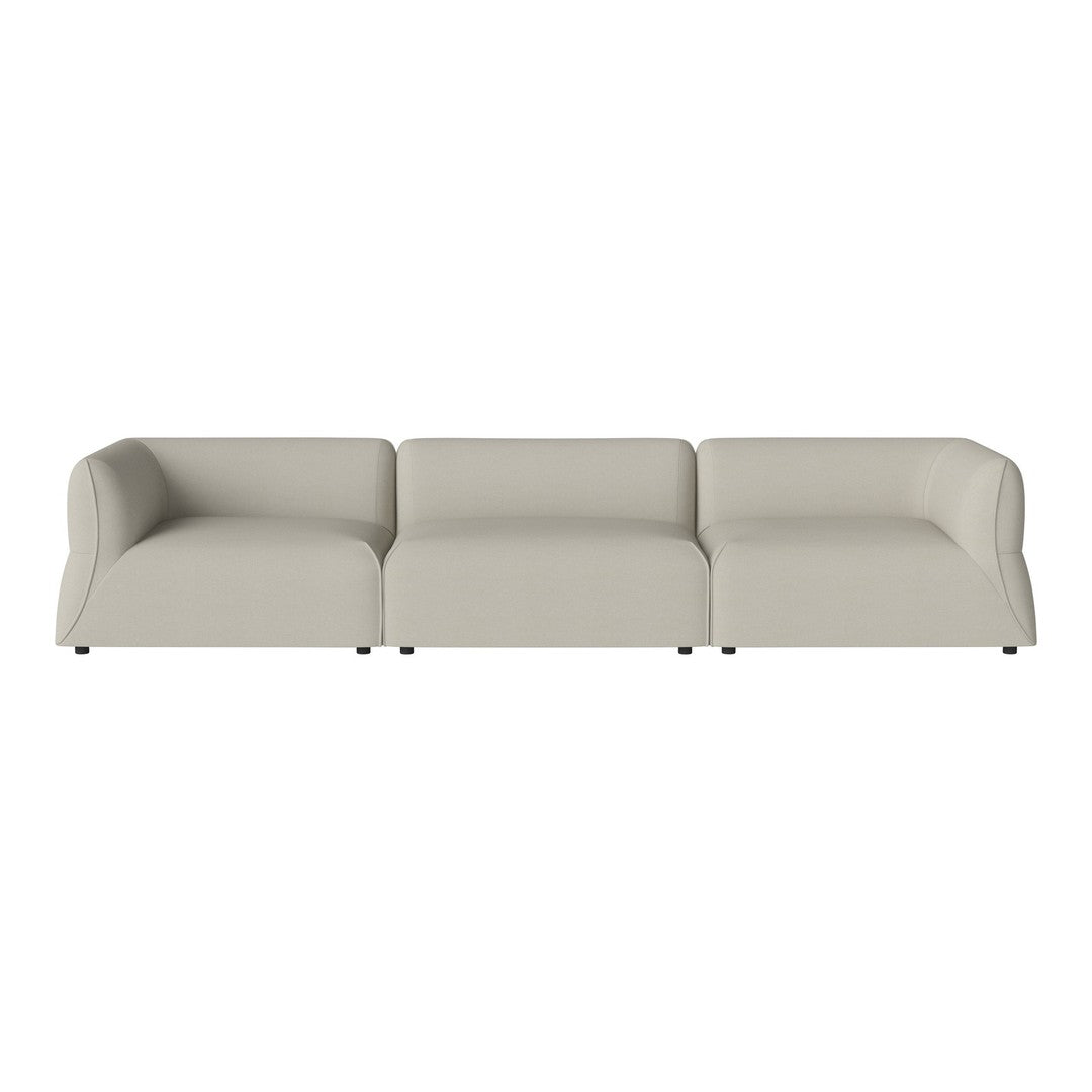 Light beige, smooth fabric three-seater sofa with minimalist design and no visible patterns.