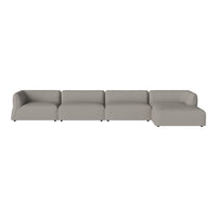 Modern sectional sofa in soft gray fabric with clean lines and a minimalist design. Ideal for contemporary interiors.