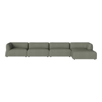 Sleek sectional sofa in muted olive green fabric with a minimalist design and smooth, modern lines.