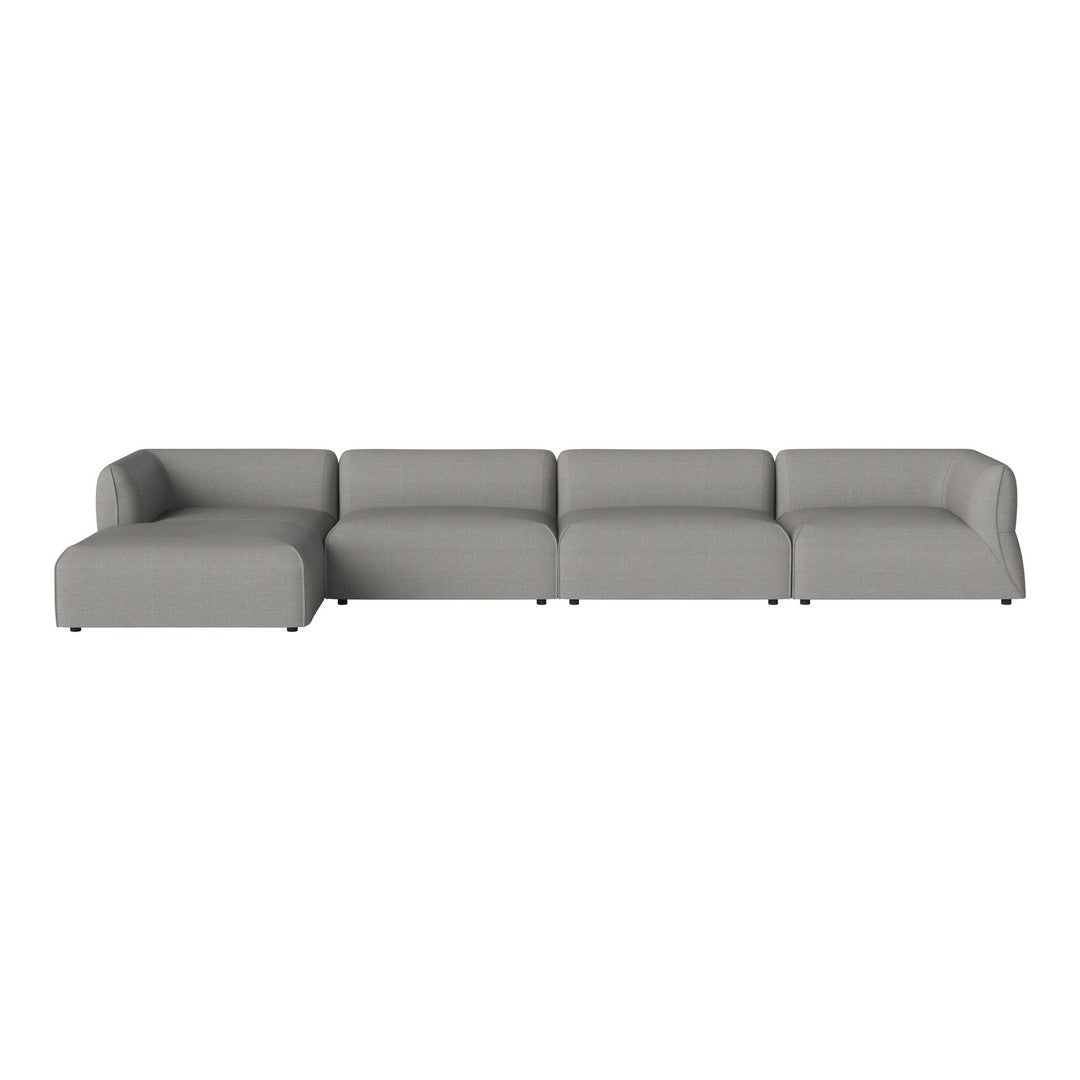 Modern sectional sofa in soft gray upholstery with clean lines and minimalistic design.