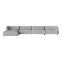 Modern sectional sofa in soft gray fabric with a minimalist design and smooth, seamless contours.