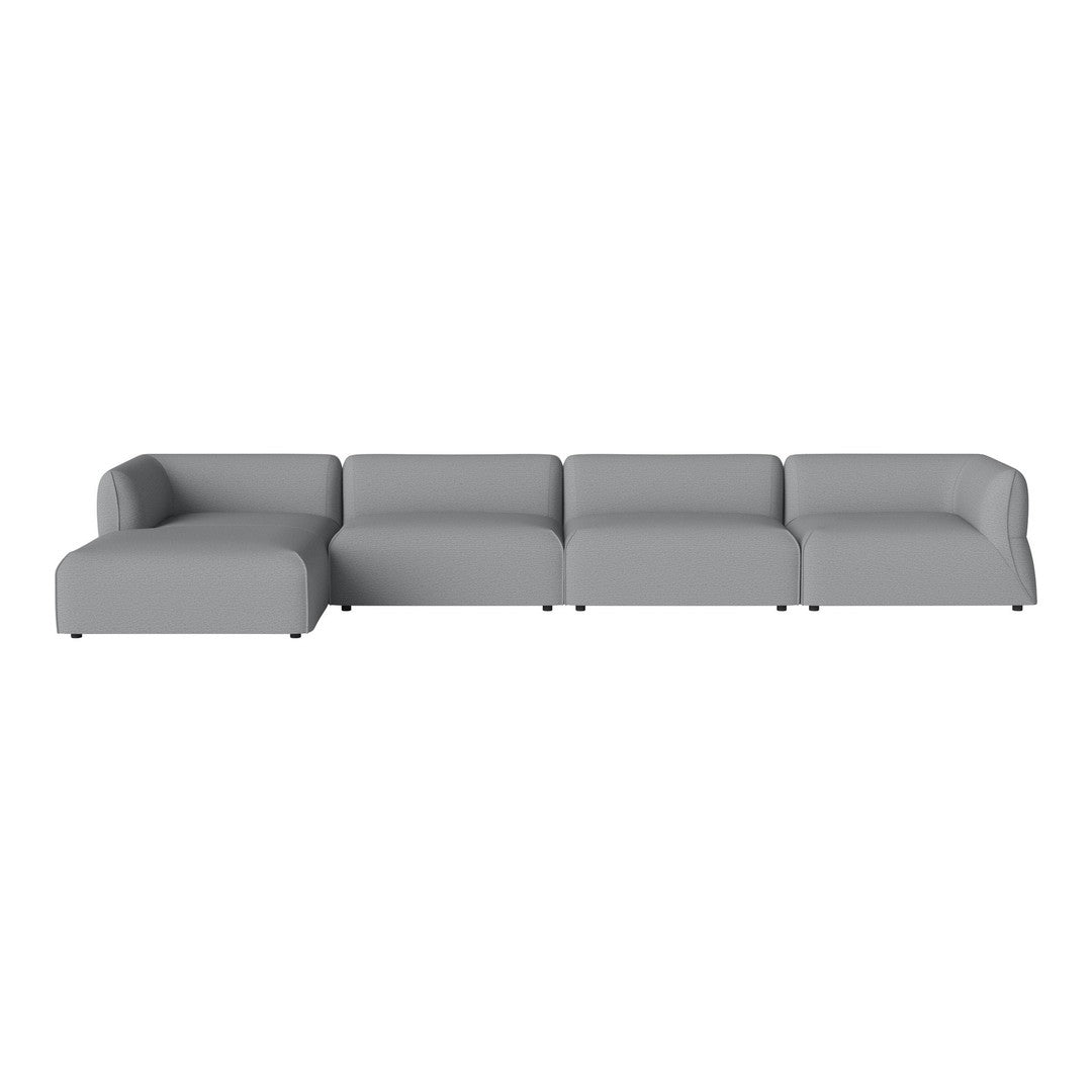 "Modern sectional sofa in soft gray fabric, featuring clean lines and a minimalist design."