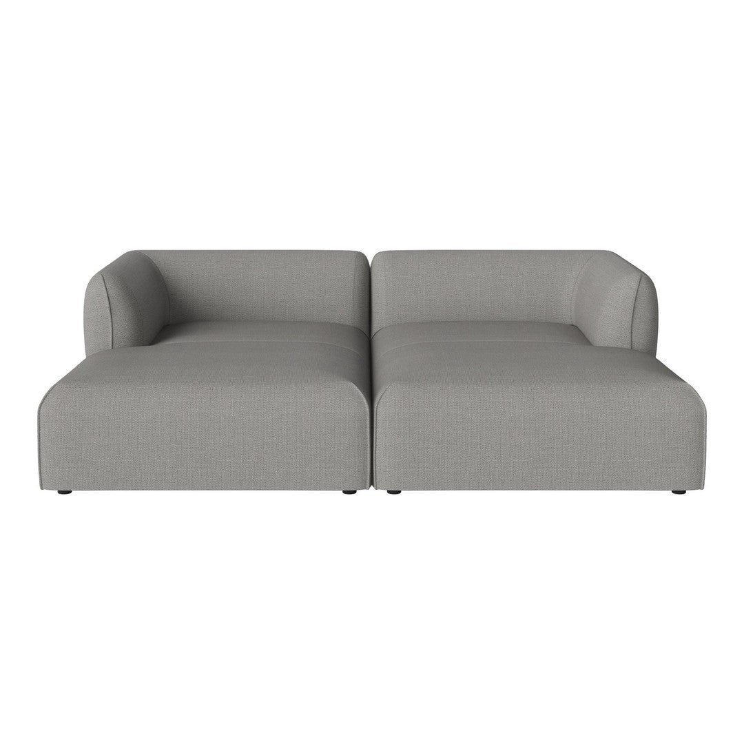 Gray modern sectional sofa with smooth texture and minimalist design, perfect for contemporary living spaces.