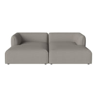 Light gray modular sofa with a smooth, minimalist design and rounded arms, perfect for modern décor.