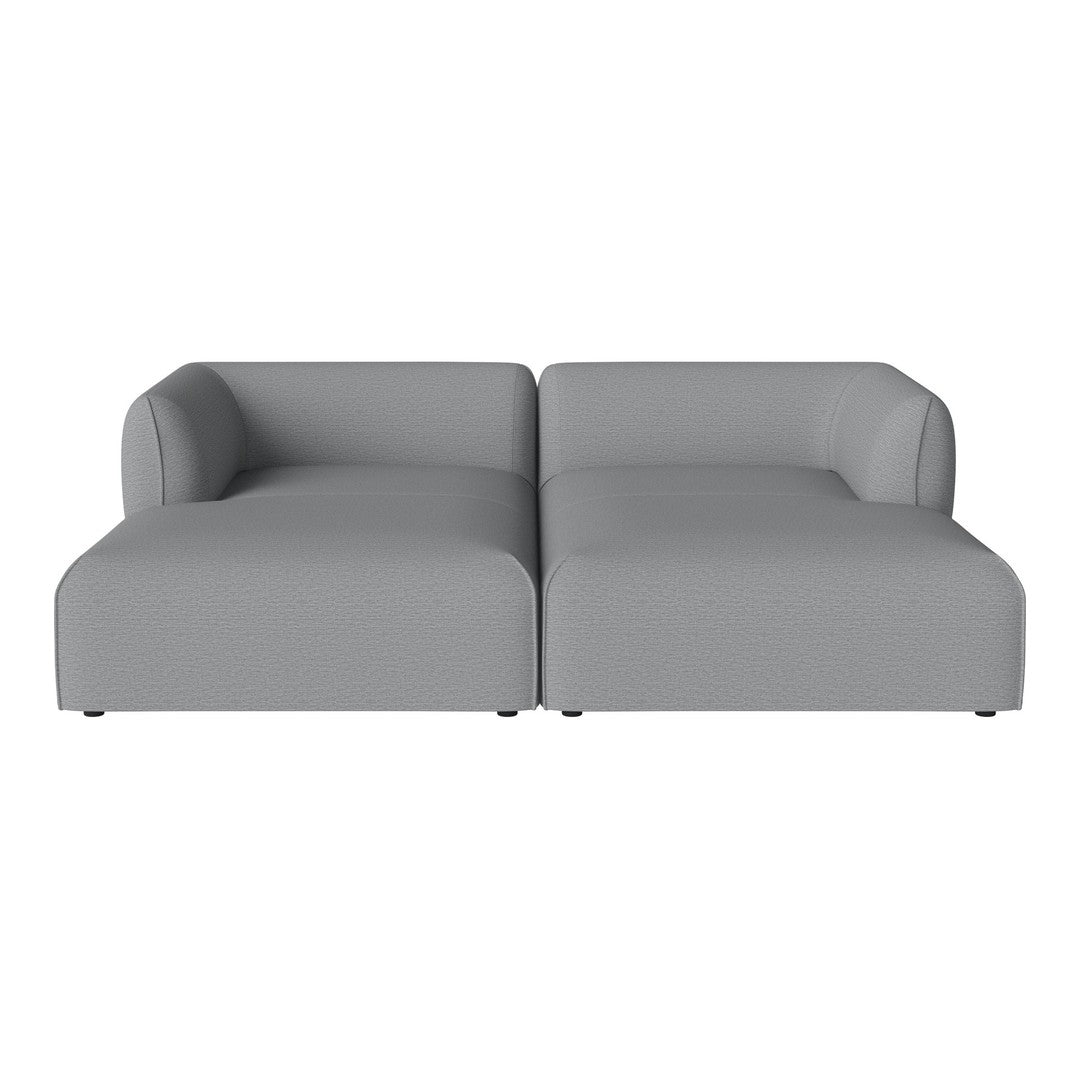 Gray modular sofa with smooth, minimalist design and no patterns for a contemporary look. Ideal for modern spaces.