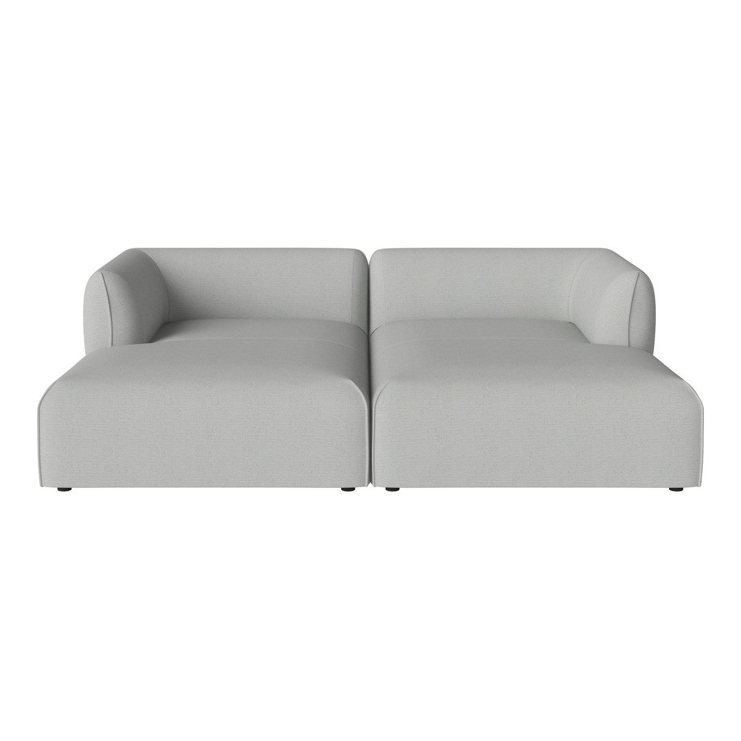 Light gray two-piece sectional sofa with smooth, modern lines and minimalistic design.