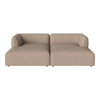 Beige modular sofa with a smooth texture and minimalist design, featuring clean lines and a contemporary look.