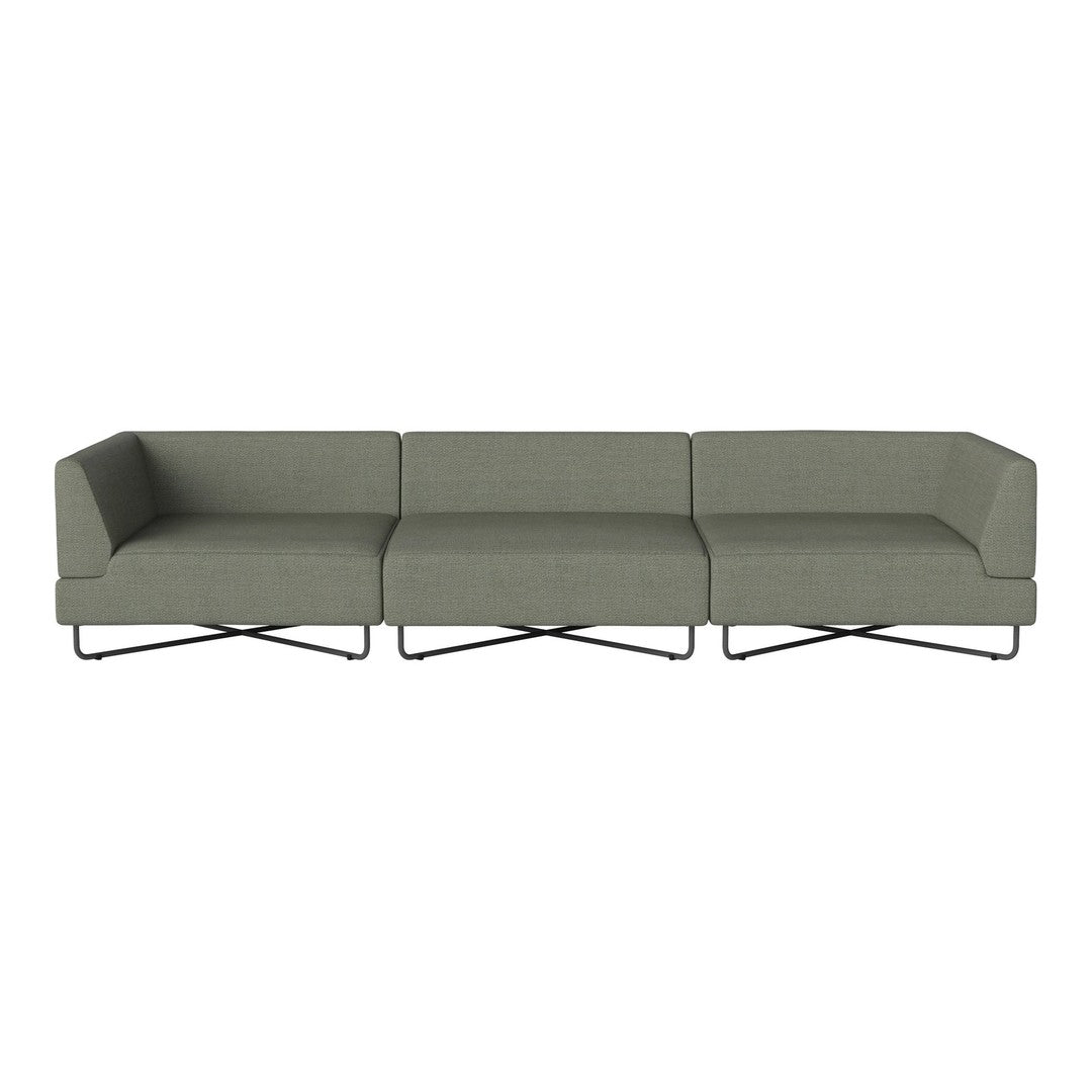 Modern sectional sofa in muted olive green fabric with sleek black metal base and minimalist design.