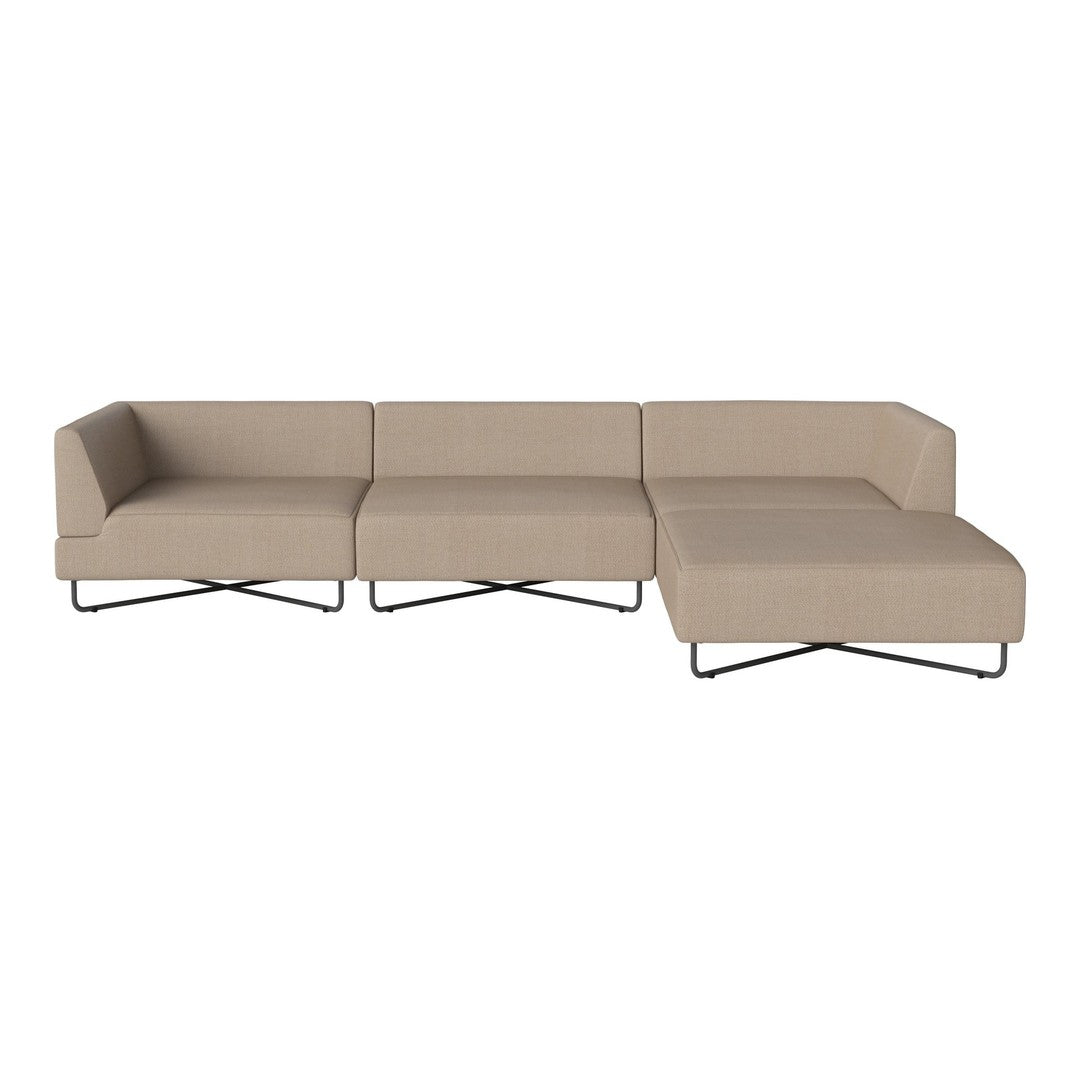 Beige sectional sofa with clean lines and minimalistic design, featuring a smooth upholstery and black metal legs.