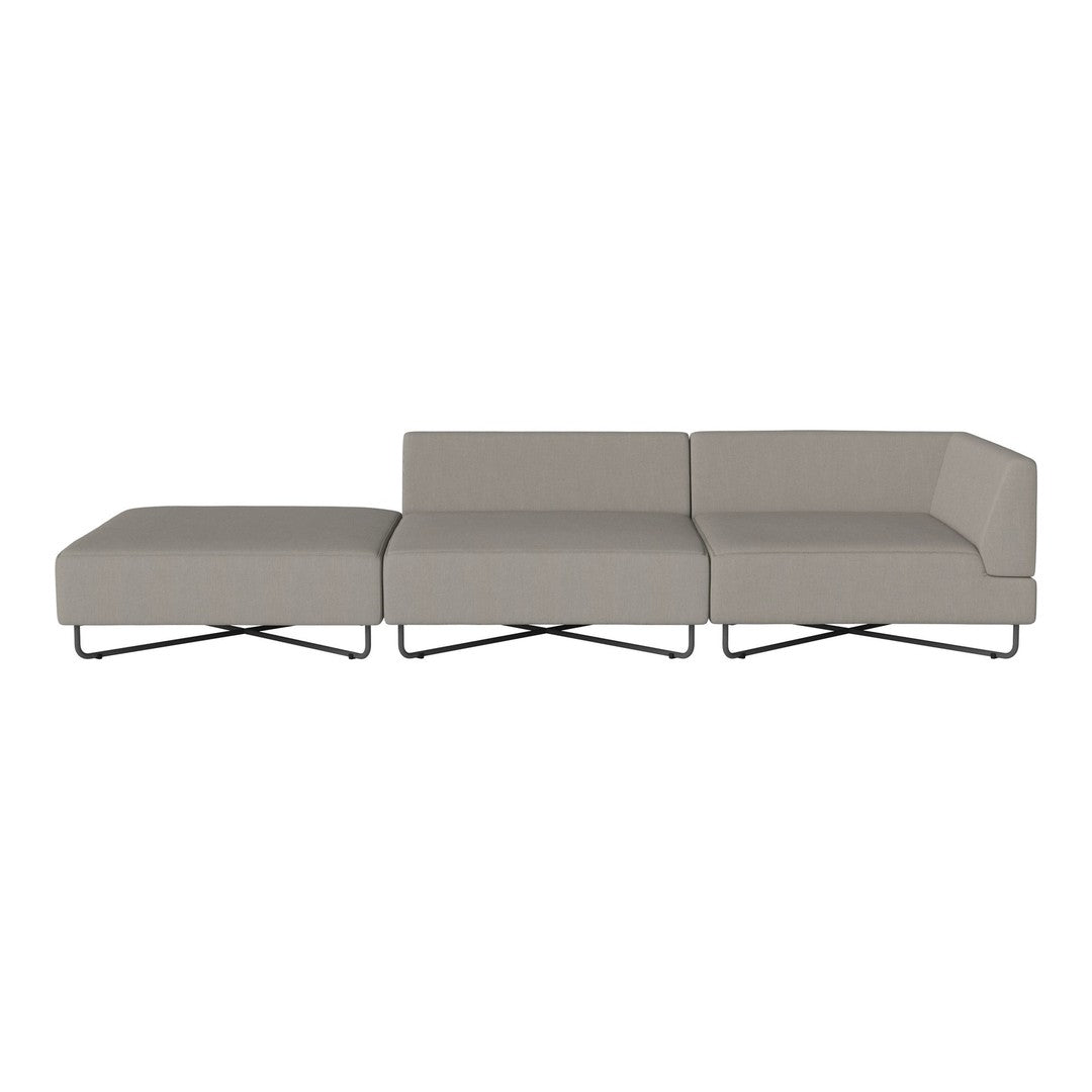 Contemporary gray sectional sofa with clean lines and a smooth texture, featuring sleek metal legs.
