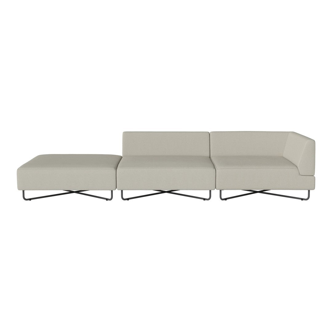 Modern beige sectional sofa with sleek lines and minimalistic style, featuring a smooth fabric and contrasting metal legs.