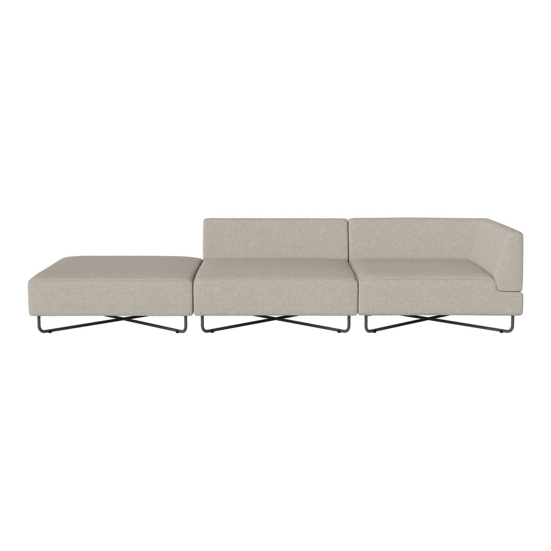 Light beige fabric sofa with a minimalist design and sleek black metal legs, featuring a solid color pattern.