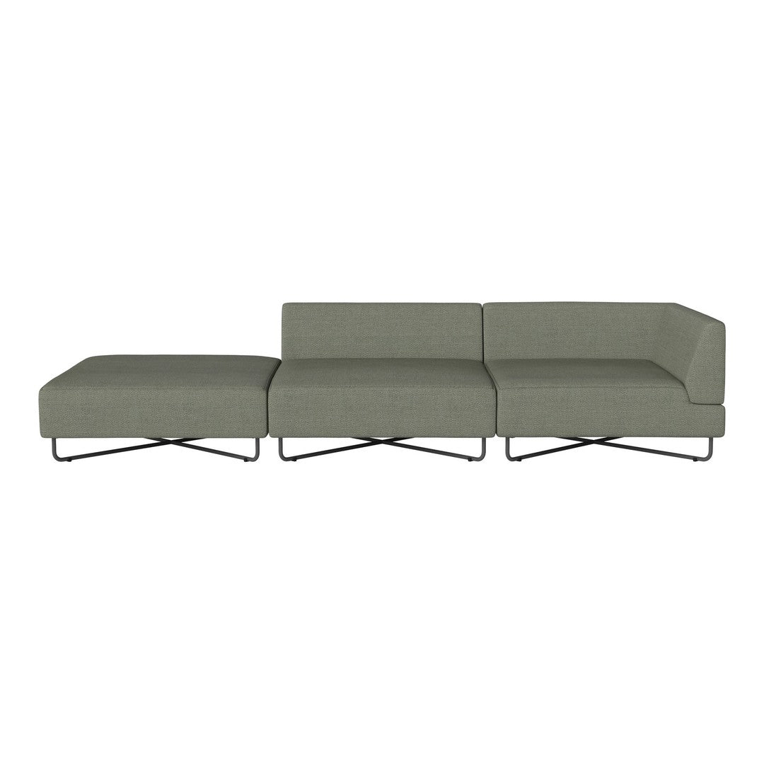 Modern sectional sofa in muted green fabric with clean lines and minimalist design, featuring a sleek metal base.