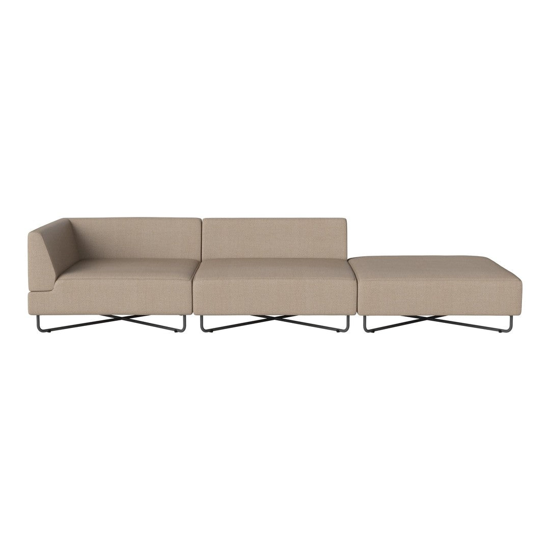Beige sectional sofa with a minimalist design and smooth, contemporary lines, resting on sleek metal legs.