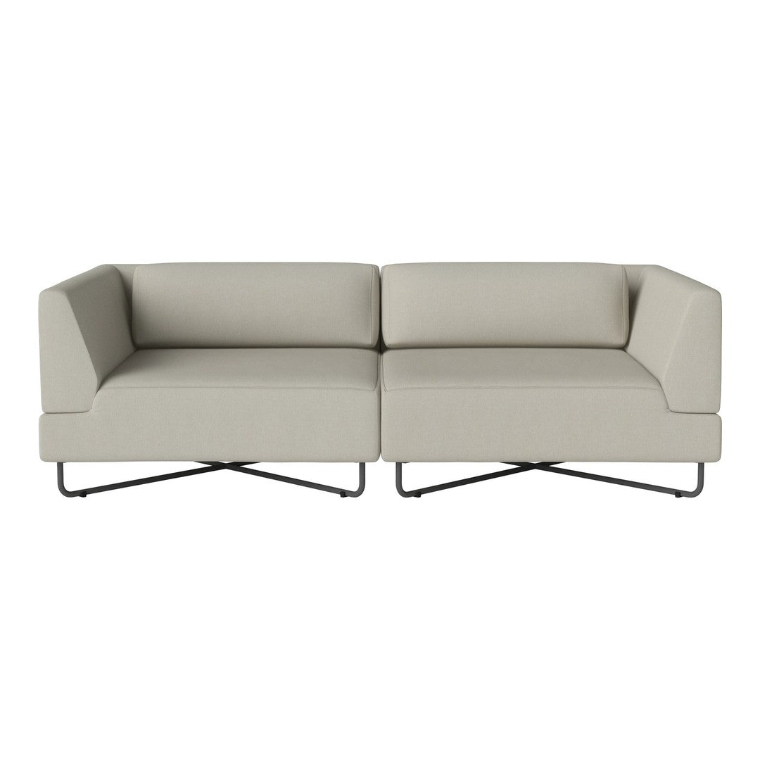 Beige modern sofa with clean lines and minimalist design, featuring a smooth fabric texture and sleek metal legs.